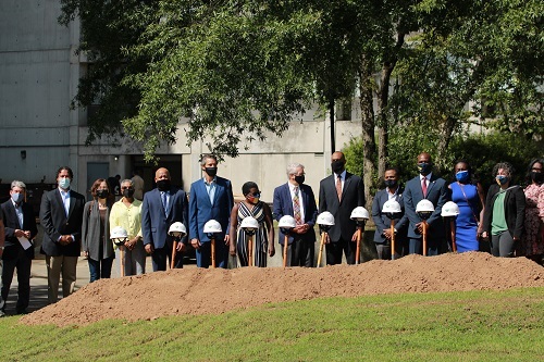 People assembled to break ground on new building